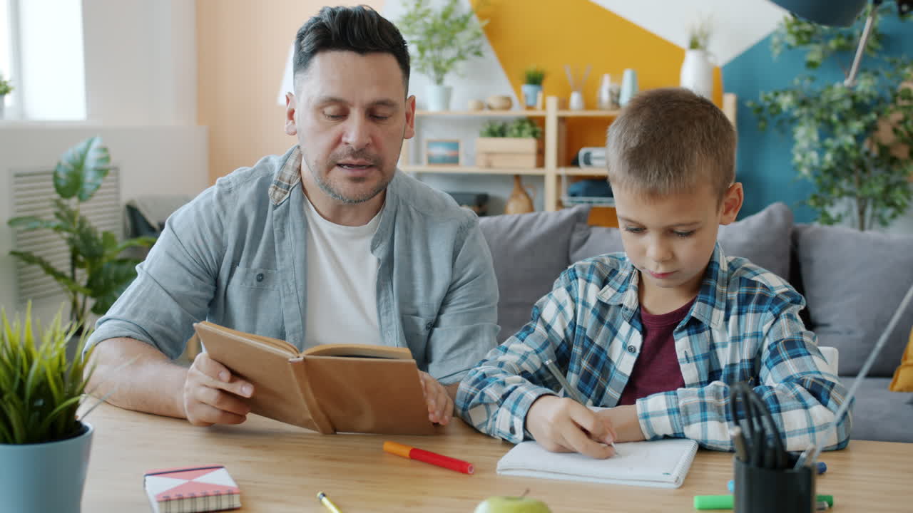 Father teaching his son at home