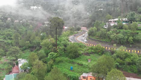 aerial flying view of traffic along hillside curve e75 expressway linking islamabad to murree in punjab province