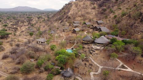 A-nice-aerial-drone-shot-of-Sangaiwe-Tented-Lodge-with-a-swimming-pool-overlooking-the-impressive-Tarangire-National-Park-in-Tanzania-in-Africa