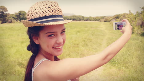 Pretty-brunette-taking-a-selfie