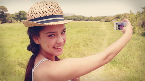 pretty brunette taking a selfie