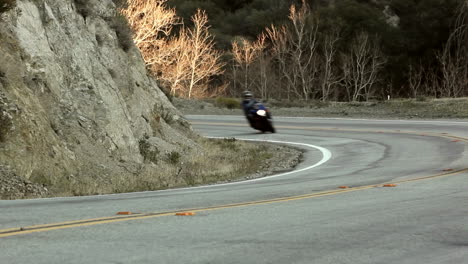 motorcycle and cars on winding mountain road 6