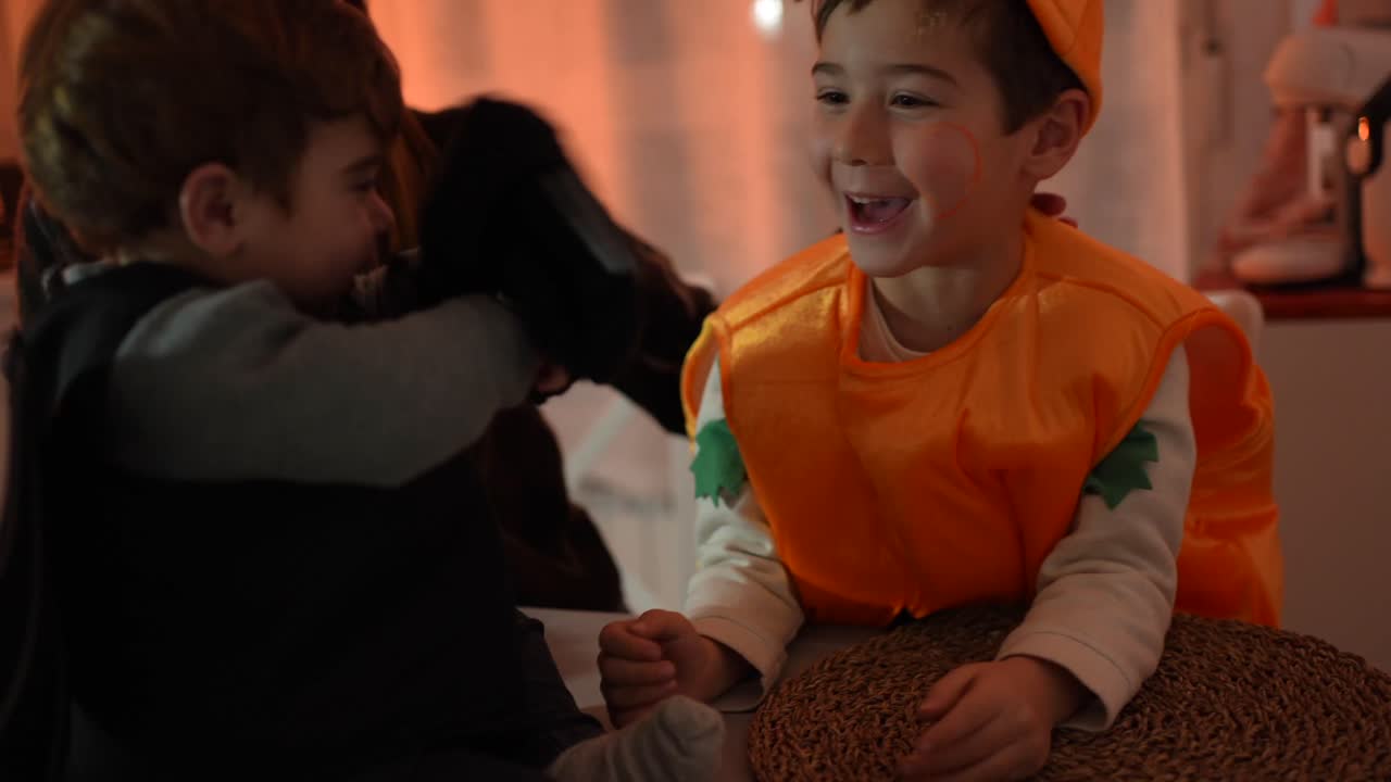 Boys in Halloween costumes with mother