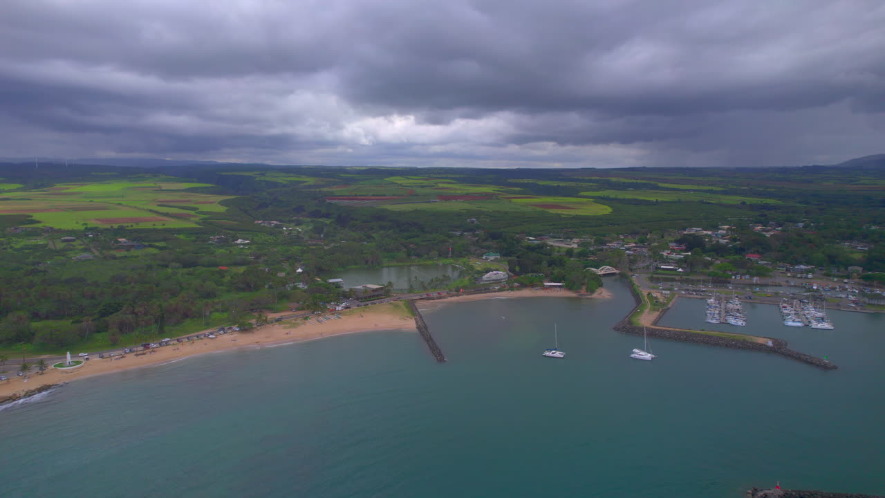 Left to right flyover of Hale'iwa fishing and boat harbor and landscape in Hale'iwa Oahu Hawaii
