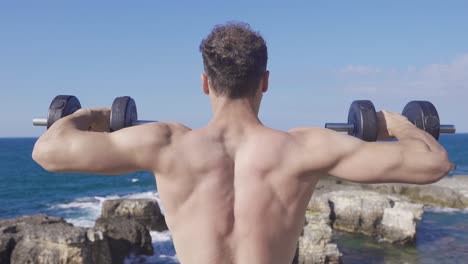 muscular fit young man does sports.