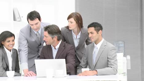 business people working with a laptop in office