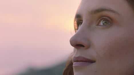 close up portrait of beautiful woman exploring spirituality looking up praying contemplating journey with wind blowing hair in countryside enjoying peaceful sunset