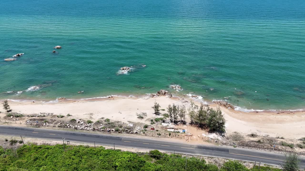 Aerial View Dolly of the Forest, Road and the Sea in Ho Tram