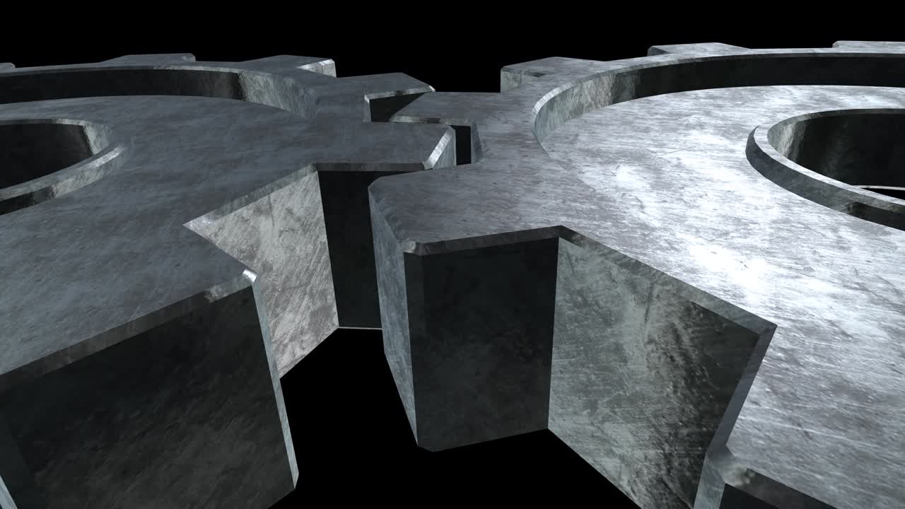 el viejo mecanismo de los dos engranajes grises está girando. fondo negro. cerca. canal alfa