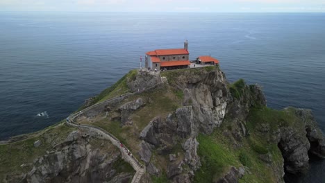 aerial retreating pullback of gaztelugatxe monastery, basque, north-western spain