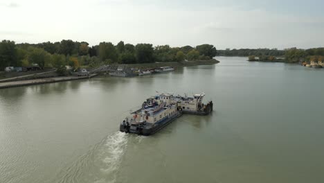 towboat pushing another towboat on danube river in bratislava, slovakia, aerial view