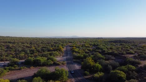 Jeep-and-SUV-driving-through-desert-road-during-sunset-on-travel-adventure-in-Arizona