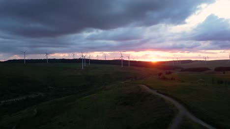 aerial footage of windfarm at sunset