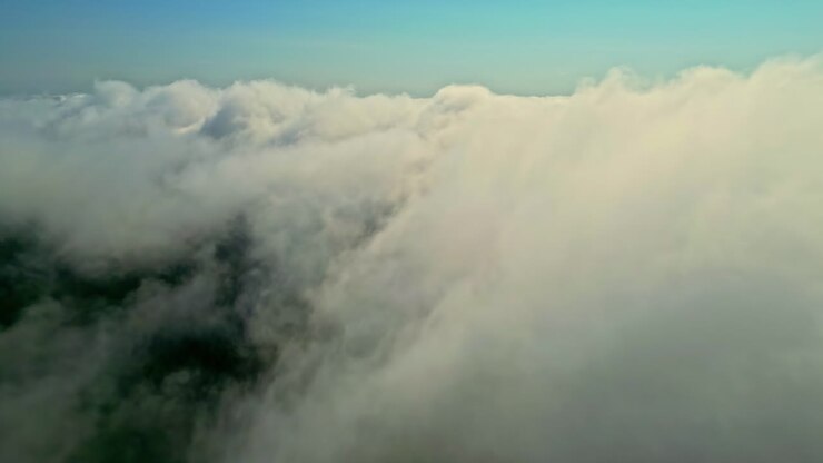 Aerial view flying over pollution smoke clouds, dangerously poor air quality