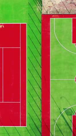modern sports complex outside. new construction for doing different kinds of sports in the city. sport grounds in a sunny day. aerial flight. vertical video
