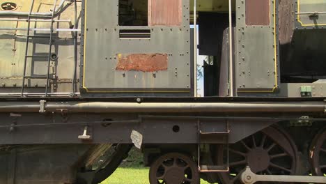 an old train sits rusting in a rail yard