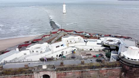 fort perch rock new brighton sandstone coastal defence battery museum birdseye aerial view pull back tilt up reveal