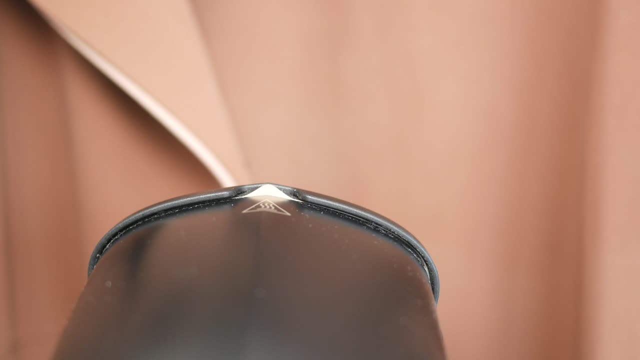 Ironing Clothes with a Steamer