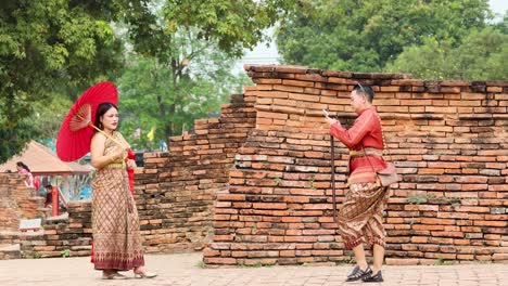 tourists in traditional attire posing for photos