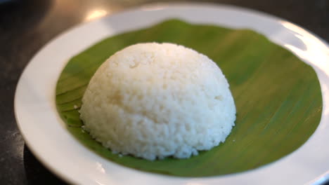 bowel of rice plating on banana leaf eggs and curry dish south indian food-3