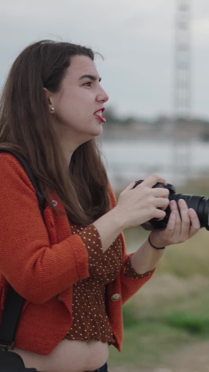 Woman taking photos with camera