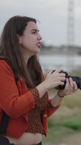 woman taking photos with camera