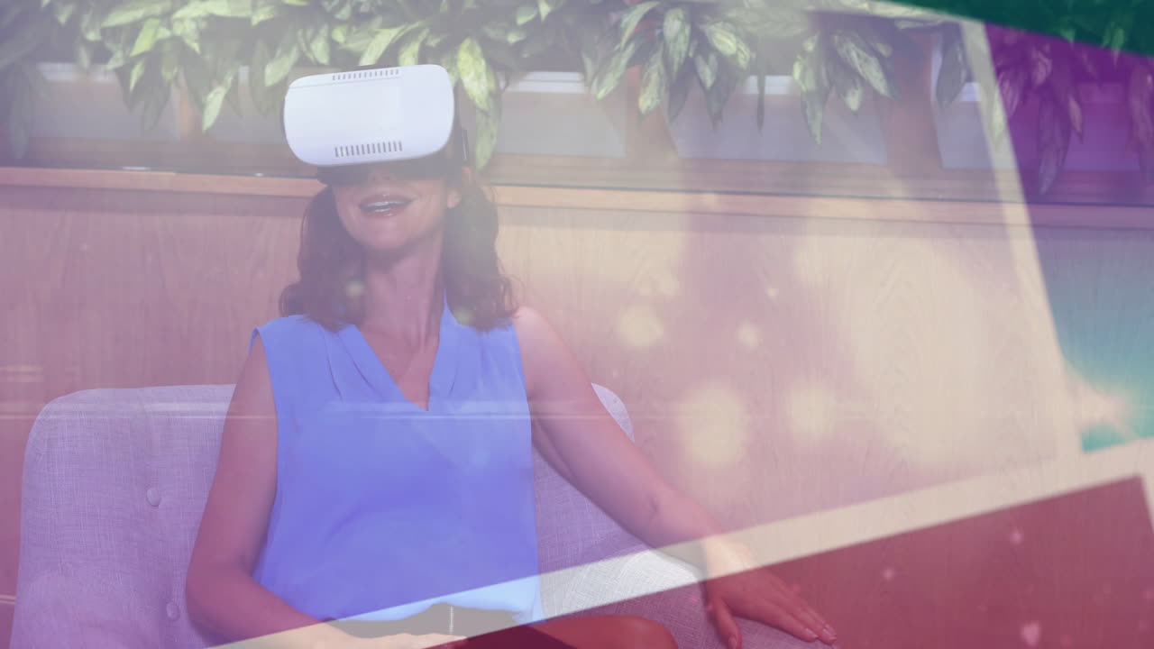 Woman wearing VR headset on grey couch in lounge, exploring VR technology with purple graphics