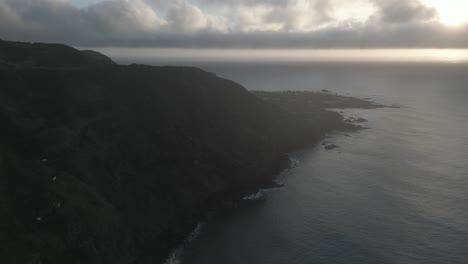 The-joao-bom-trail-coastline-at-sunset,-overlooking-mosteiros-village,-aerial-view