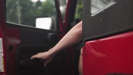 Close-up-mans-hand-opening-car-door-and-getting-inside