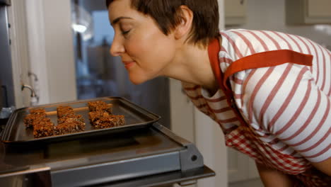 woman opening the oven