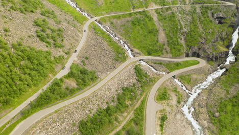 Bird's-Eye-View-Of-The-Vehicles-Traveling-At-The-Famous-Trollstigen-Mountain-Pass-In-Norway