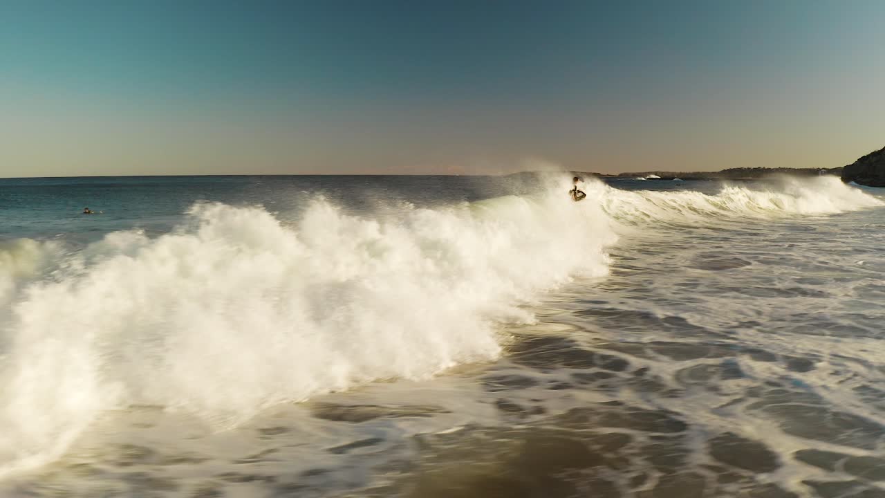 A powerful ocean wave breaking near a coastline