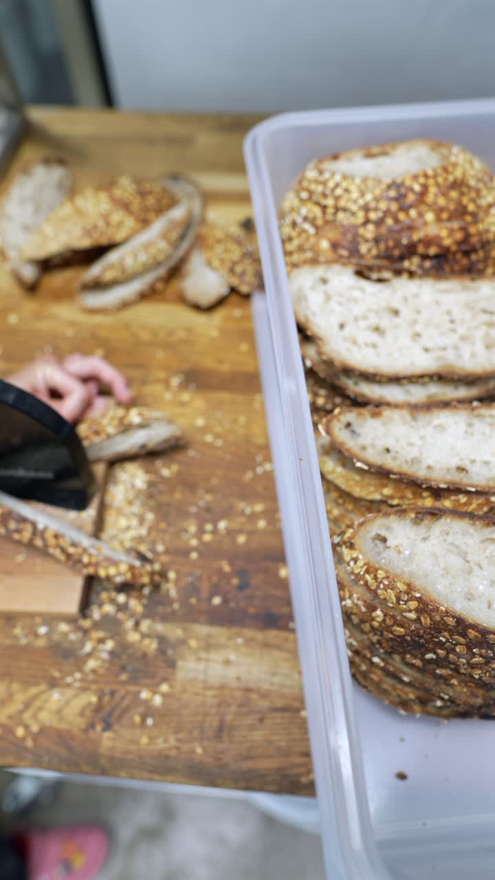 Sliced Bread in a Container and Hands Holding Bread Slice
