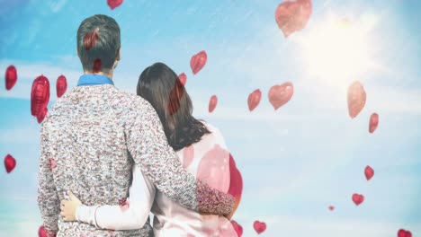 Couple-holding-each-other-and-looking-at-the-sky-together