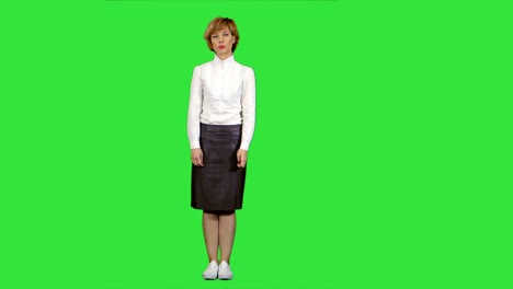 cheerful speaker making business presentation on a green screen, chroma key