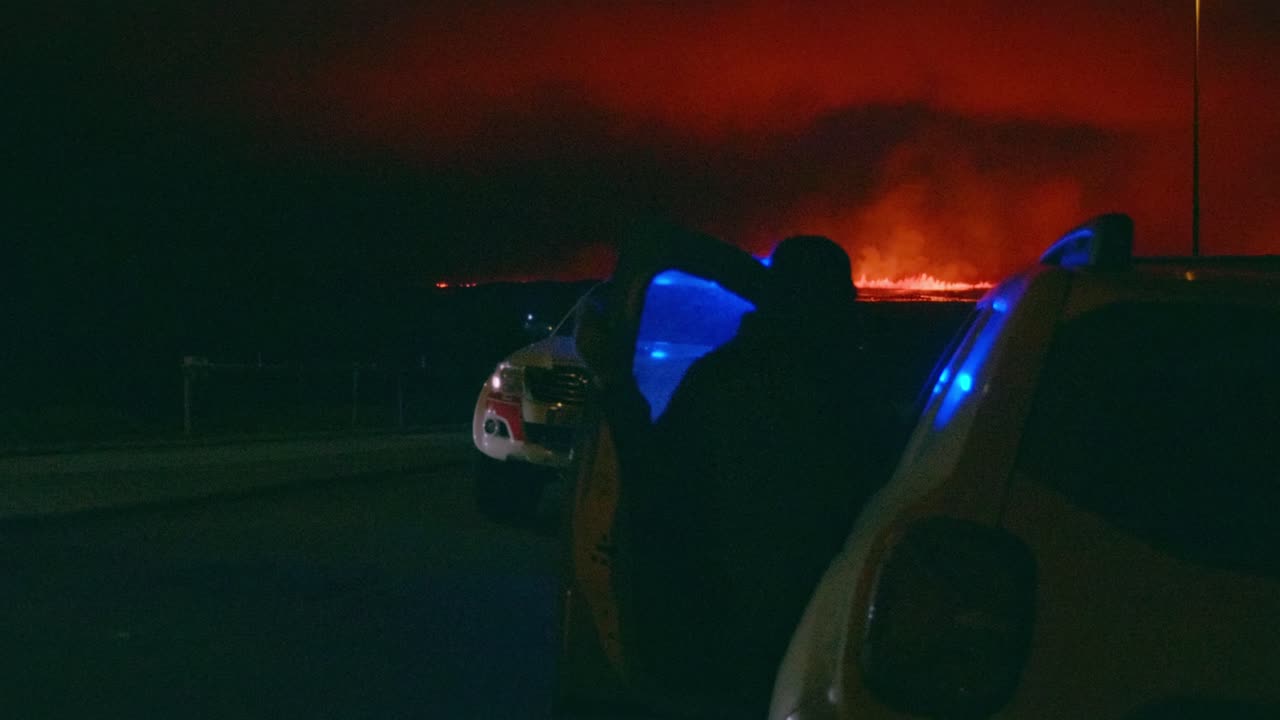 person getting into their car at a volcanic eruption - slow motion shot