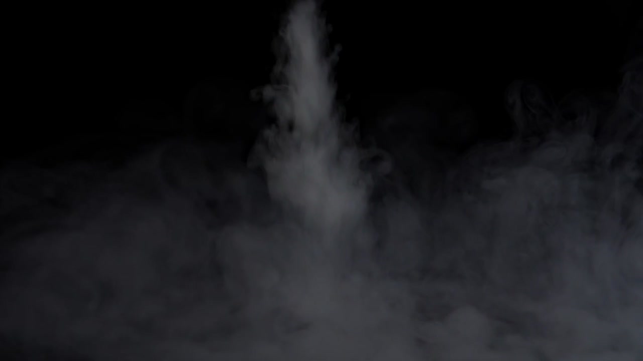White Water Vapour On A Black Background, Close-Up , Slow Motion