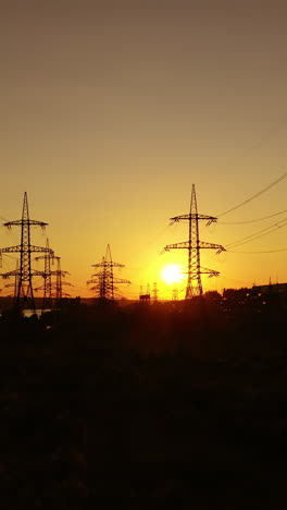 electric tower of high voltage. aerial view of high voltage power lines silhouette