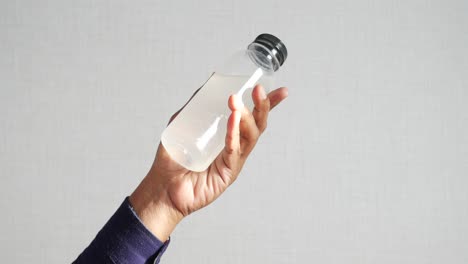 a person holding a water bottle