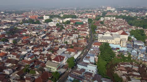 The-face-of-overpopulated-city-in-Malang,-East-Java,-Indonesia,-showcases-the-rapid-increase-in-population-as-the-primary-contributor-to-high-pollution-rates-in-develope-country-Indonesia