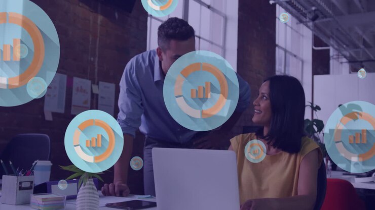 Animation of digital business icons over diverse business people in office