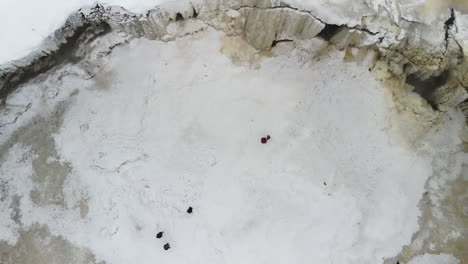drone flying over frozen waterfall in estonia europe its winter and very icy