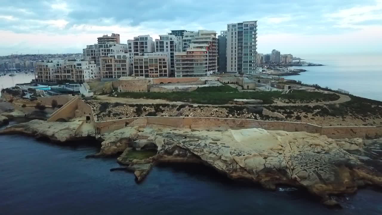 Aerial View of Sliema, Malta: Modern Buildings and Coastal Fortifications