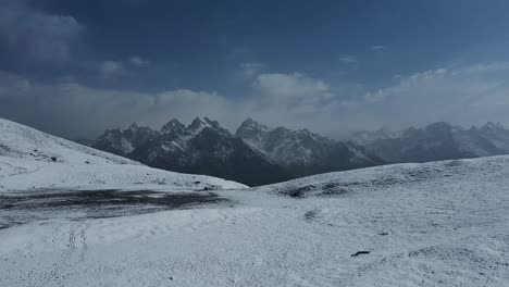 mountain scenery from the snow-covered sar pass top in the indian himalayas, himachal pradesh, india