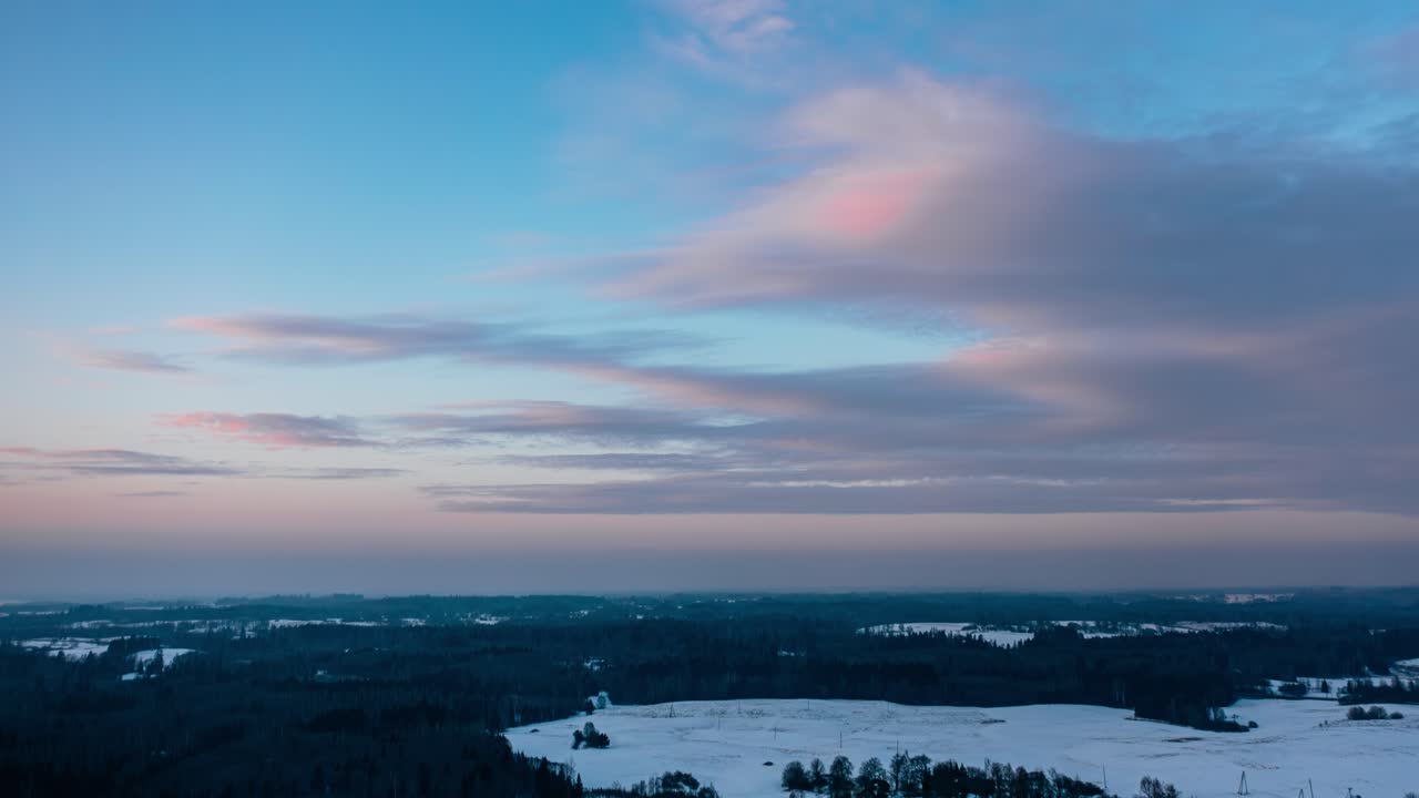 Aerial winter evening cloudscape hyperlapse. Magenta colors in the sky.