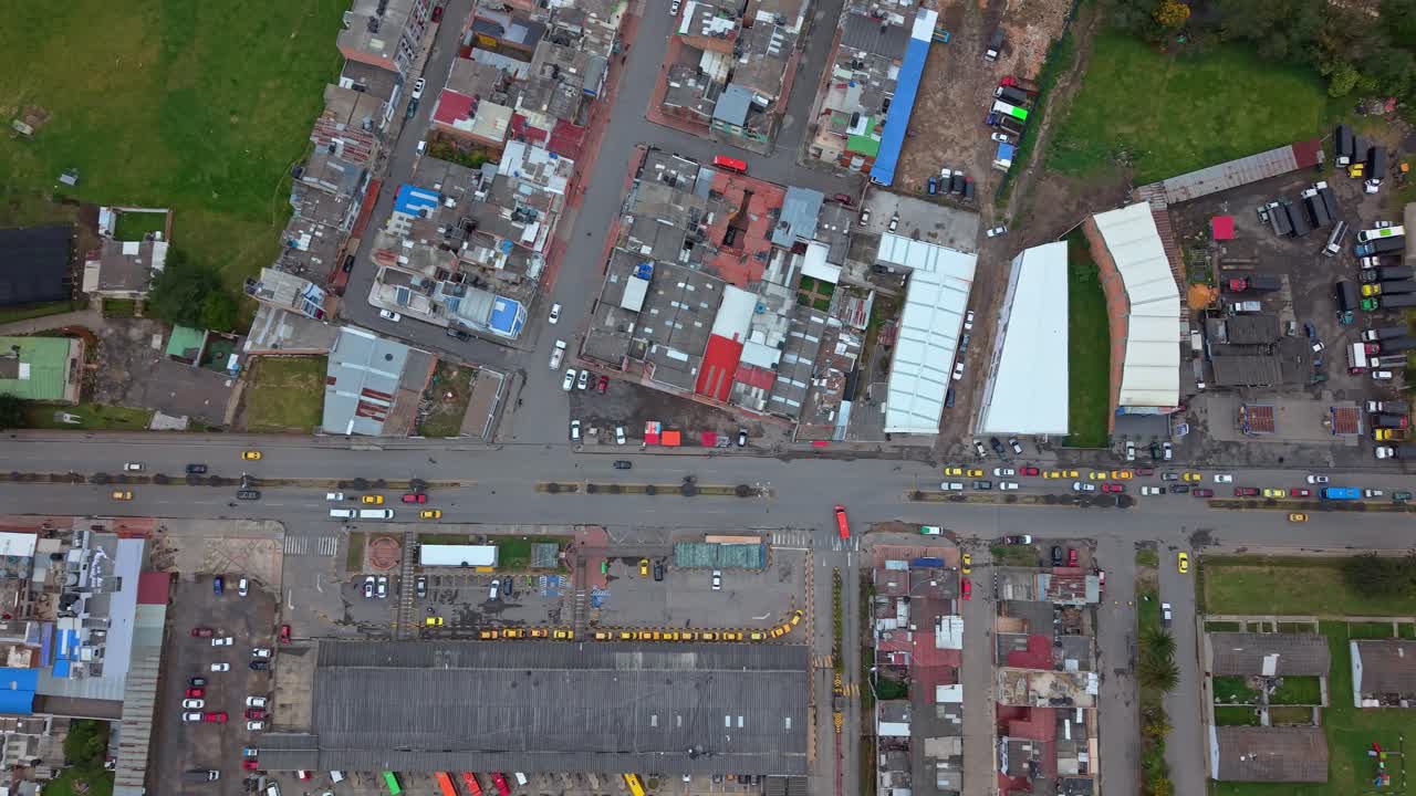 Aerial view of Chiquinquirá taxi stand, vibrant town life perspective