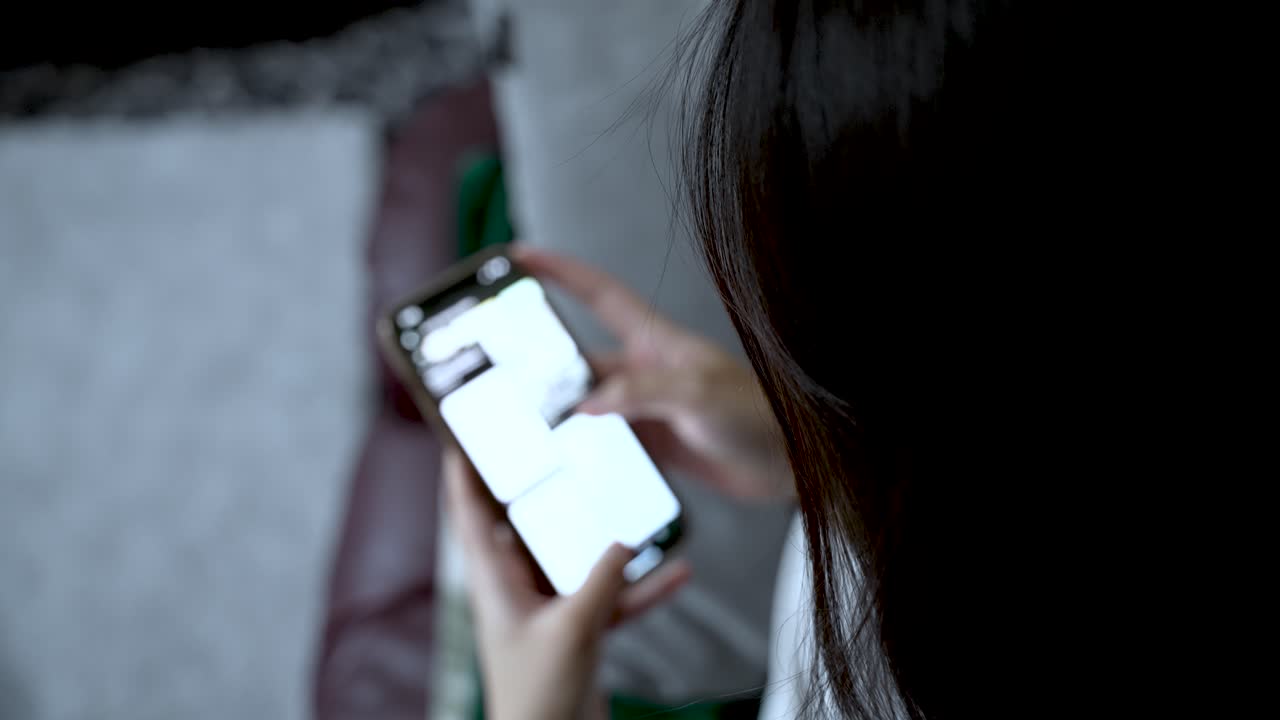 Young woman is obsessed with her smartphone, constantly scrolling through social media feeds, unable to escape the digital vortex