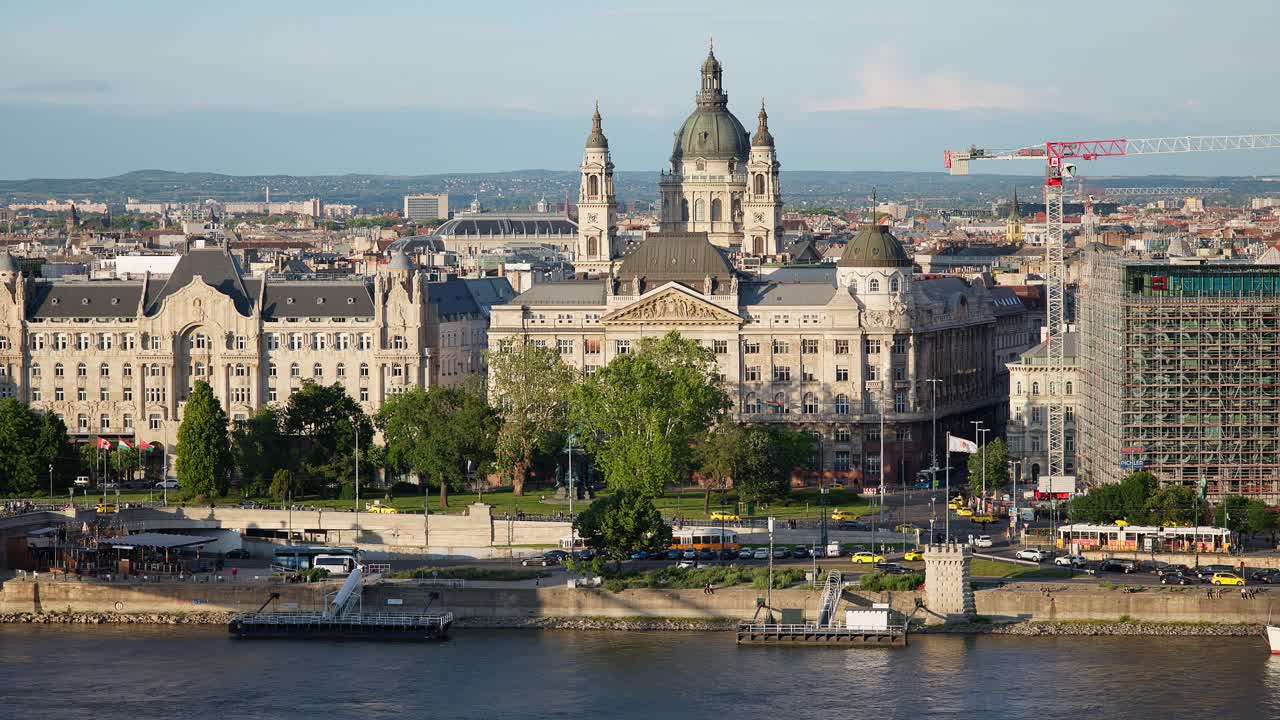 Budapest cathedral and city with traffic and trams. Hungary
