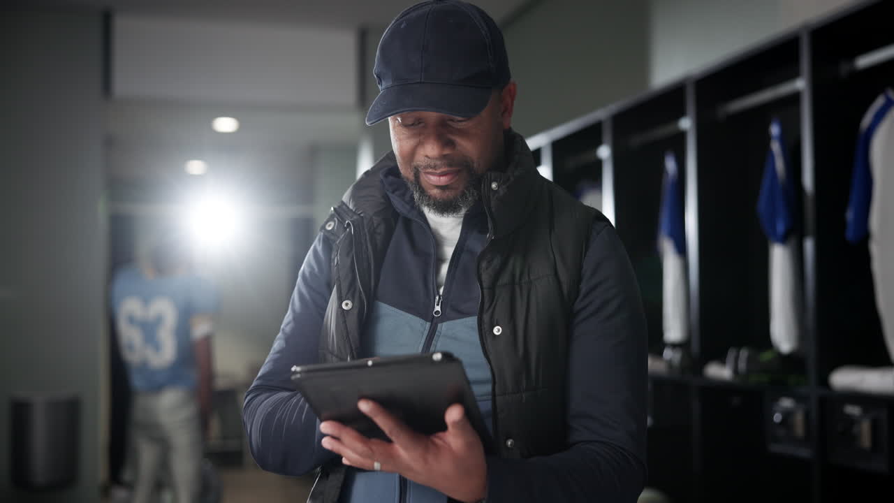 Coach gebruikt tablet in kleedkamer