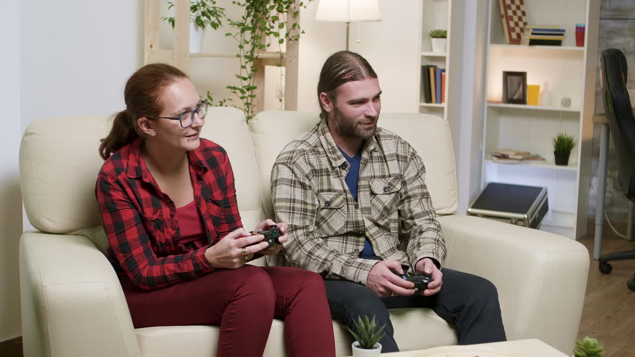 Couple Playing Video Games Together at Home